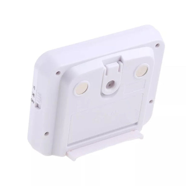 White digital kitchen timer by Sper Scientific showing the back with magnets, a stand, and a switch.
