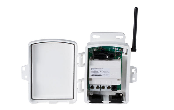 White wireless sensor transmitter by Davis Instruments with attached antenna, and ports along the bottom.