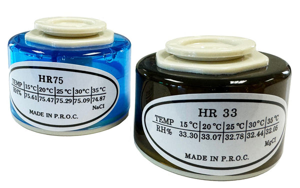 Calibration salts by Sper Scientific, blue and black, show temperature and humidity readings on the label.
