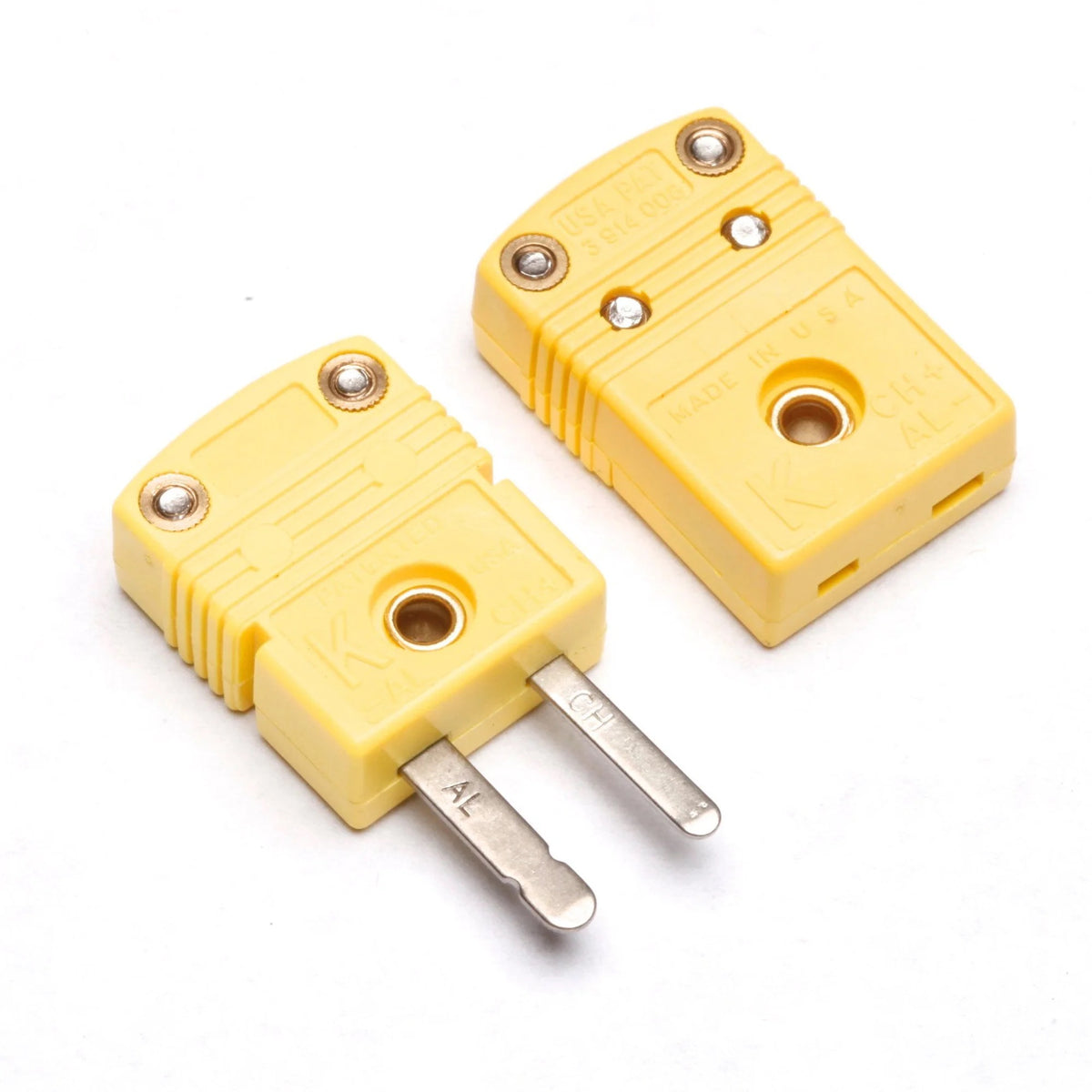 Yellow thermocouple and RTD connector by Pyromation with standard plug, showing aluminum and chrome connections.
