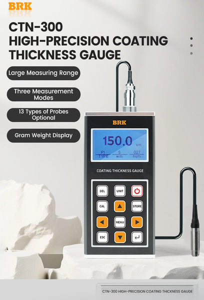 Coating thickness gauge by BRK with digital display and probe attachment on a white geometric platform.
