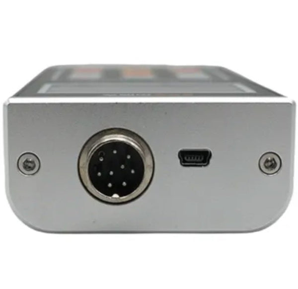 Coating thickness gauge by BRK with a silver metallic housing showing several ports and screws.
