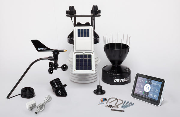 Professional weather station with fan aspirated radiation shield by Davis Instruments, including wind vane, rain collector, and LCD console.
