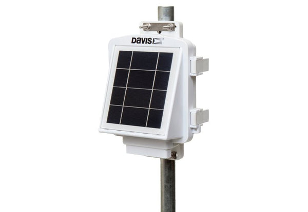 White solar panel by Davis Instruments mounted on a steel pole against a white background.
