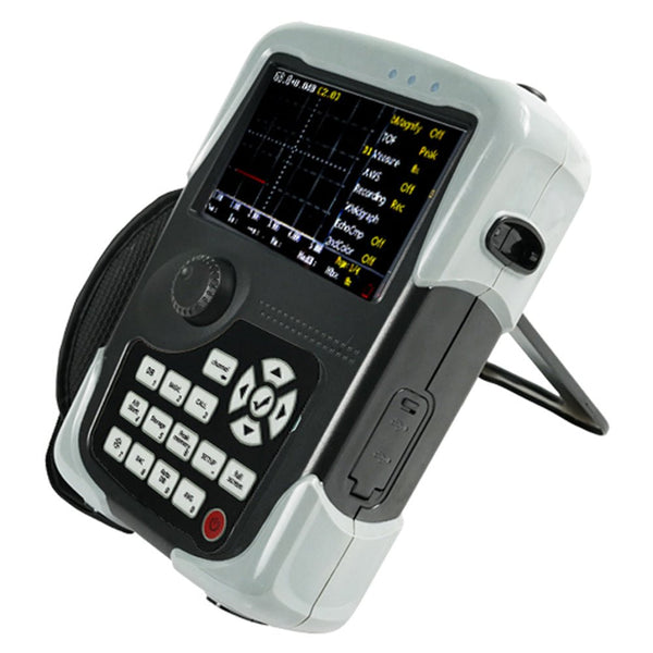 Digital ultrasonic flaw detector from BRK with a gray and black body and keypad with display screen.
