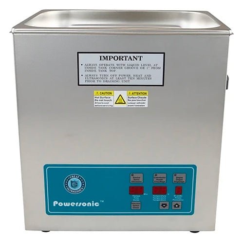 Benchtop ultrasonic cleaner by Crest Ultrasonics with a metallic finish and blue control panel.
