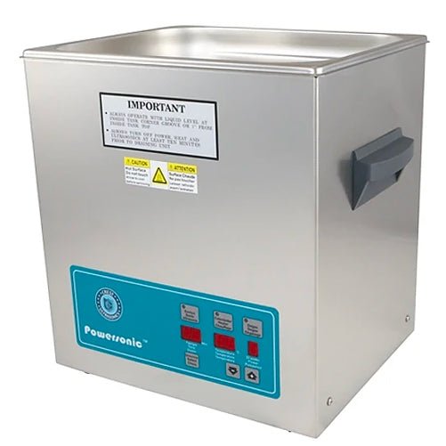 Stainless steel benchtop cleaner tank by Crest Ultrasonics with a gray handle on the side.