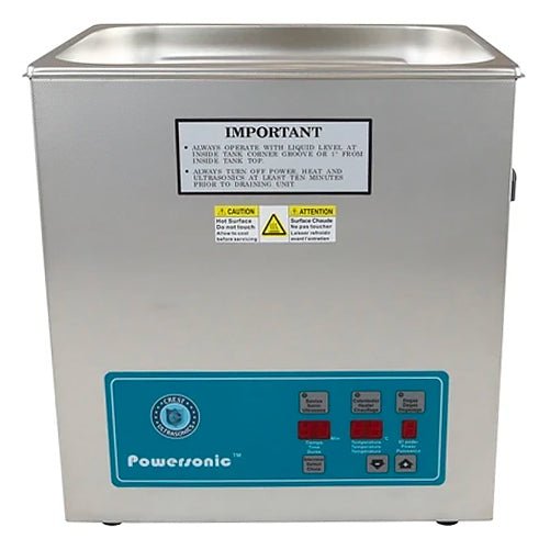 Stainless steel benchtop ultrasonic cleaner by Crest Ultrasonics, with control panel and warning labels.