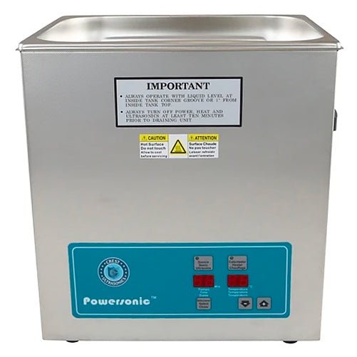 Benchtop ultrasonic cleaner by Crest Ultrasonics, featuring a stainless steel tank and a blue control panel.