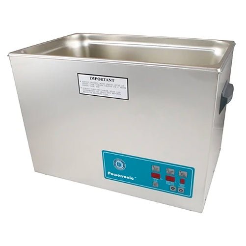 Stainless steel benchtop cleaner tank by Crest Ultrasonics with a control panel on the front.