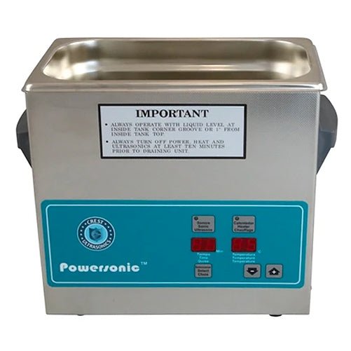 Benchtop ultrasonic cleaner by Crest Ultrasonics featuring a stainless steel tank and a digital control panel.
