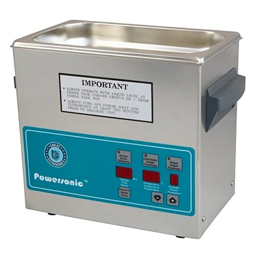 Stainless steel Powersonic benchtop cleaner by Crest Ultrasonics with a turquoise control panel.