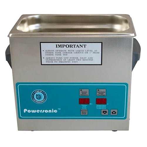 Benchtop ultrasonic cleaner by Crest Ultrasonics with a stainless steel tank and blue control panel.

