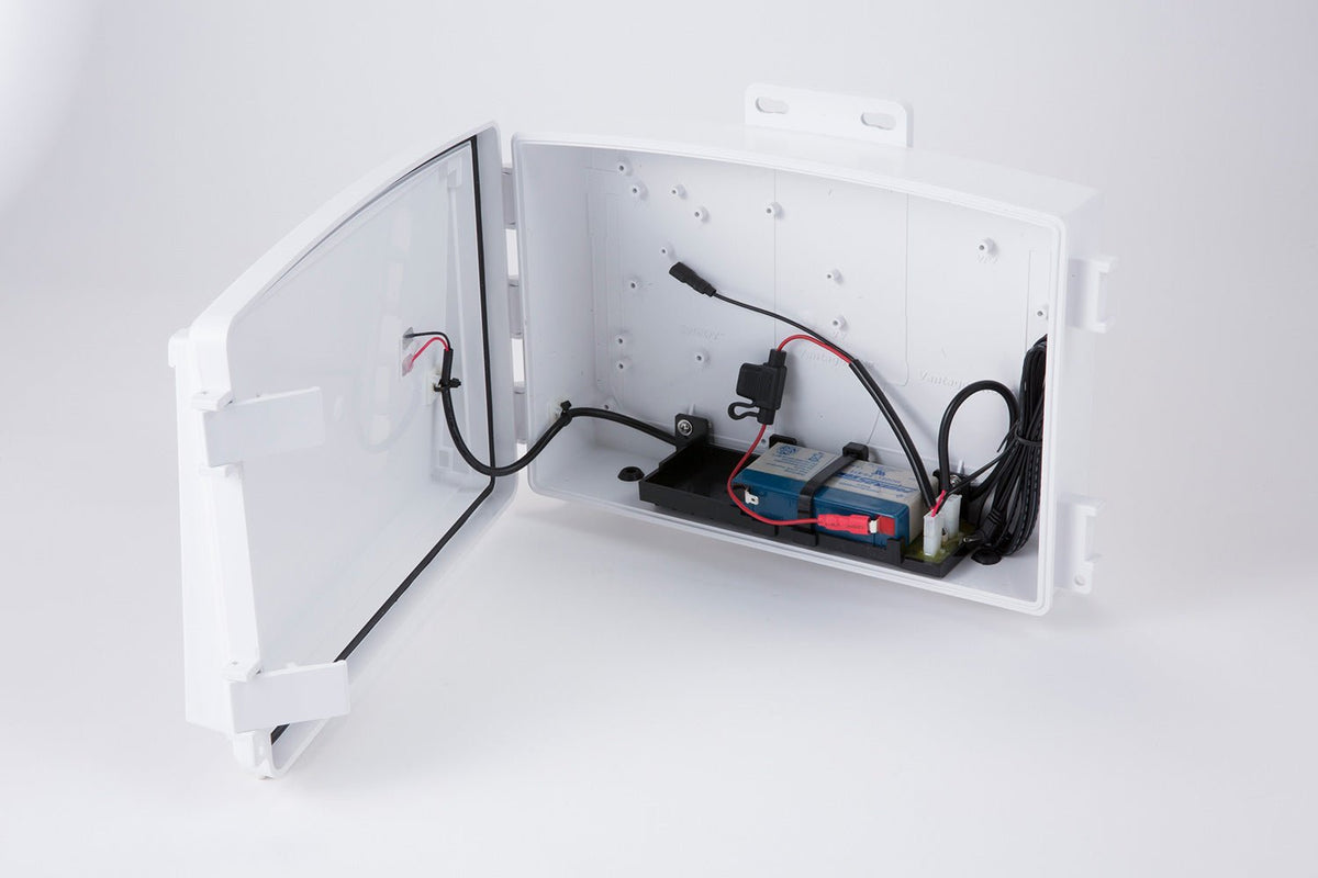 Accessory solar power kit by Davis Instruments showing batteries and wires inside a white case with an open door.
