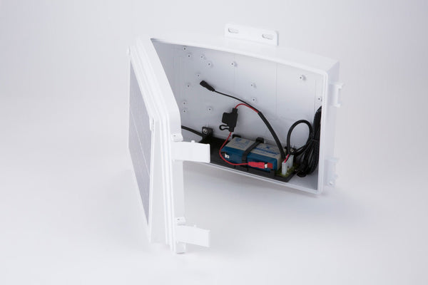 White solar power kit by Davis Instruments with visible batteries and wiring inside the open box.