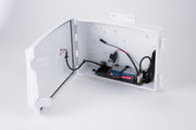 Accessory solar power kit by Davis Instruments inside a white plastic casing with wires and batteries.