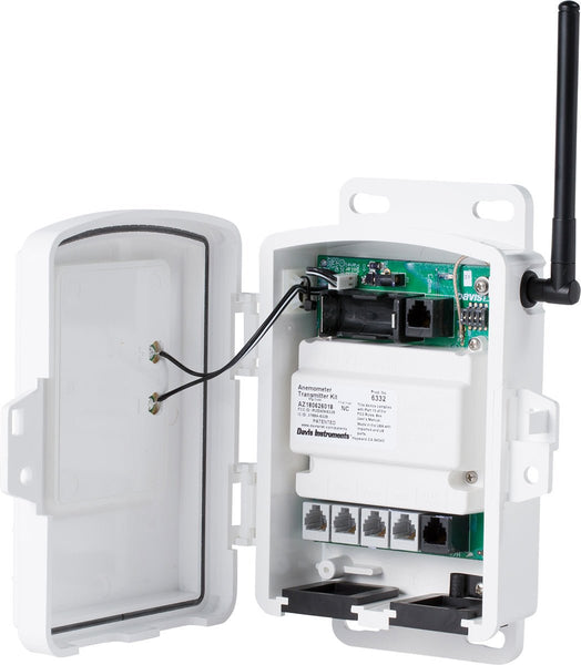 White solar-powered sensor transmitter by Davis Instruments, with an open door and an antenna.