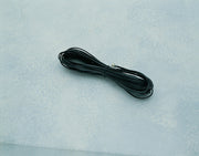 Black four-conductor cable by Davis Instruments in a coiled position on a light background.
