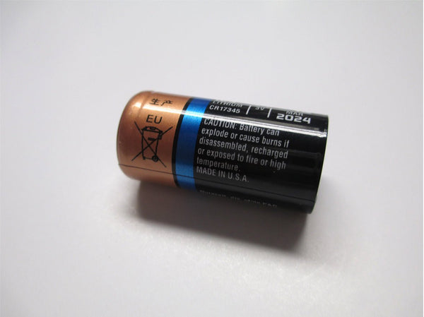 Lithium CR17345 battery by Davis Instruments with a copper top, black body, and a warning label.