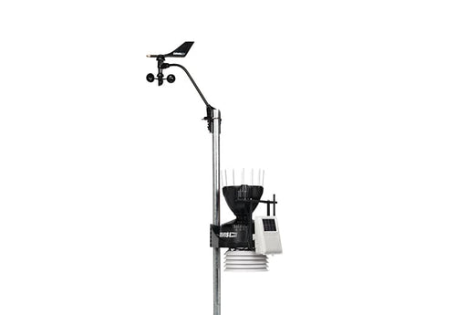 Wireless weather station by Davis Instruments, showing an anemometer and rain collector mounted on a metal pole.