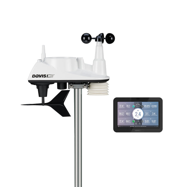 Wireless weather station with display console by Davis Instruments, showing current weather data on its LCD screen.

