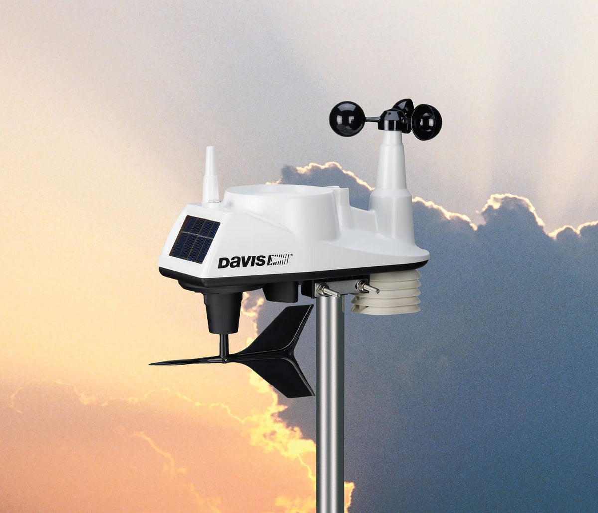 White Vantage Vue weather station by Davis Instruments, standing on a metal pole with wind speed indicator.