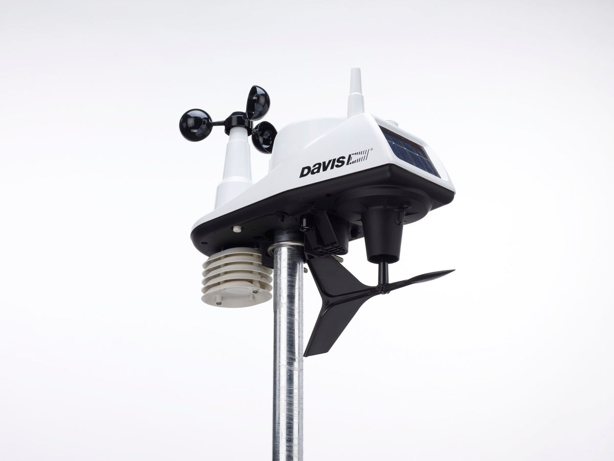 Wireless integrated weather station by Davis Instruments, mounted on a metal pole against a white background.
