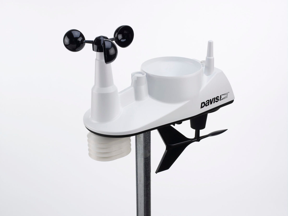 White wireless integrated sensor suite weather station by Davis Instruments with black wind cups on a silver pole.
