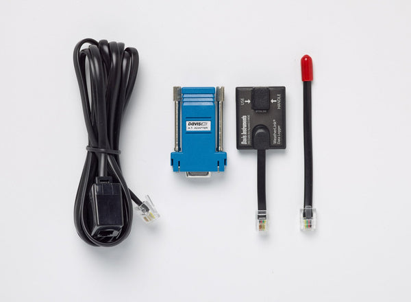 WeatherLink serial-port data logger by Davis Instruments with adapter, cables, and a red-tipped sensor.