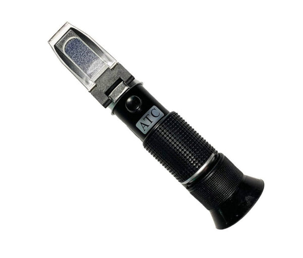 Handheld refractometer by Sper Scientific, with automatic temperature compensation, having a black, textured grip.
