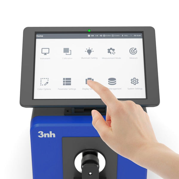 Blue benchtop grating spectrophotometer by 3nh with a hand touching its touchscreen display.
